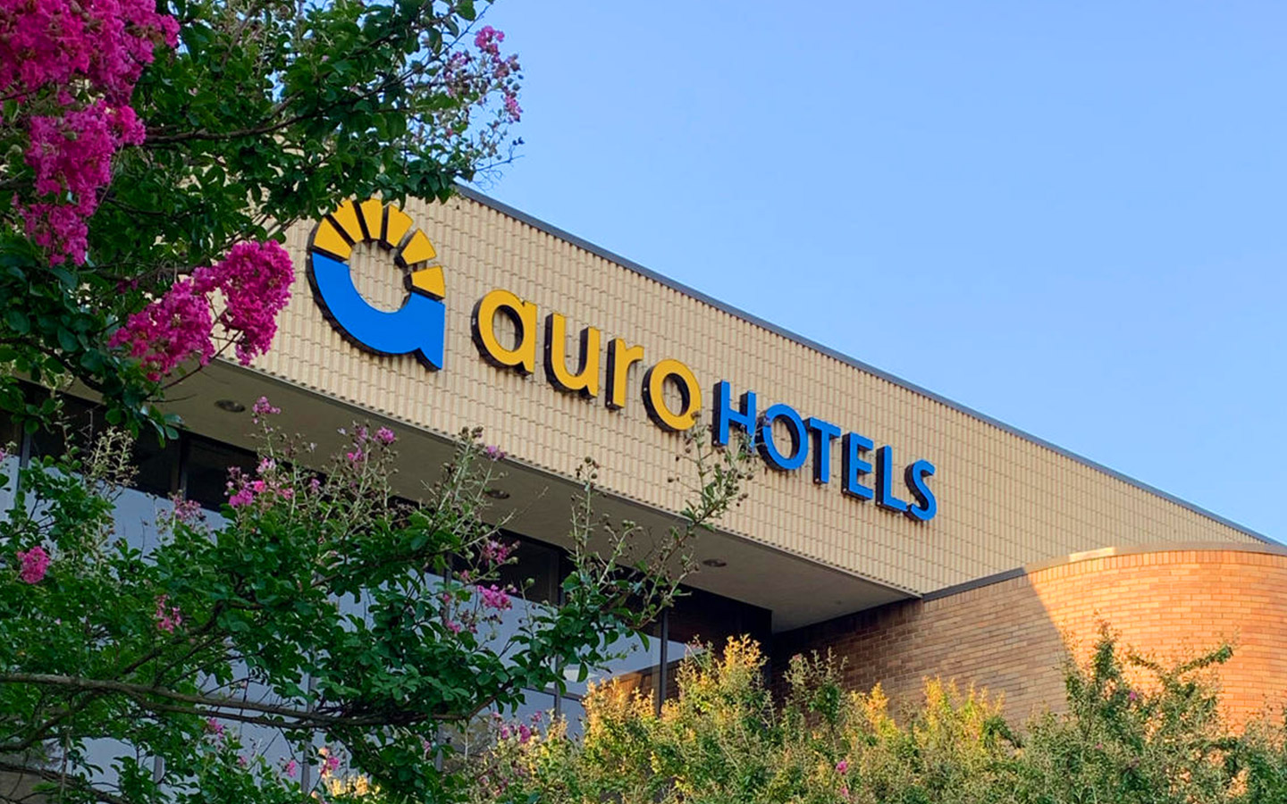 Auro Hotels exterior sign at headquarters